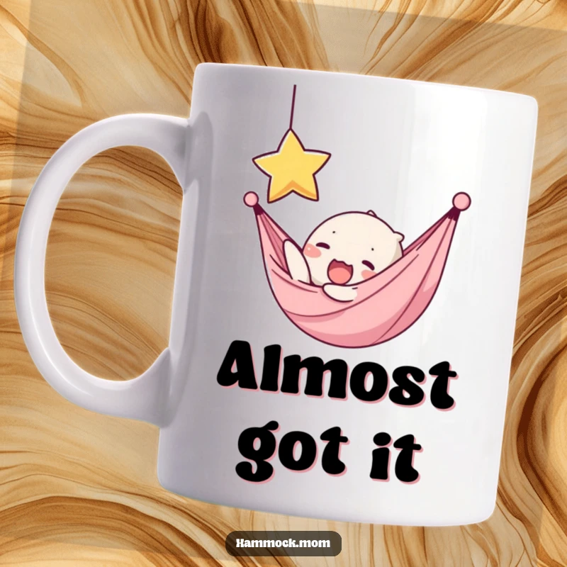 Funny mug showing a kawaii hammock character yawning while reaching for a dangling star, symbolizing hopeful ambition.