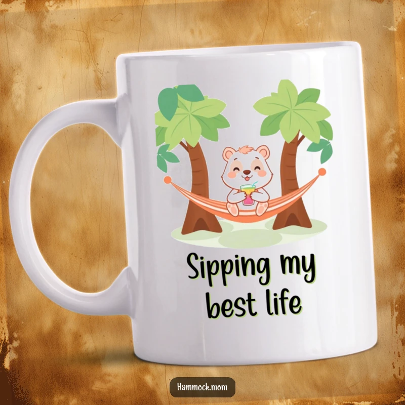 Funny mug depicting a smiling animal character leisurely sipping a drink while relaxing in a hammock strung between two trees.