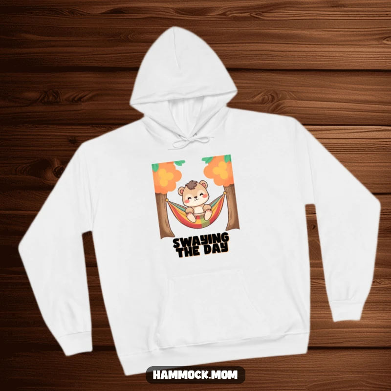 Funny relaxed animal character gently swaying in a colorful hammock between two trees, on a warm and cozy hoodie.