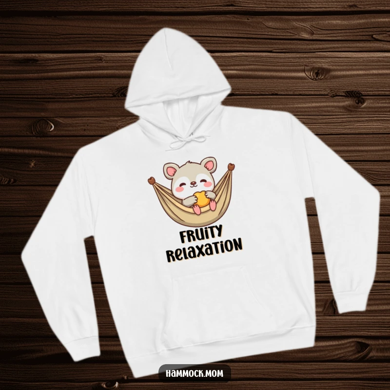 Funny Kawaii Animal Hoodie: Cute creature lounging in a hammock, offering a piece of fruit, embodying relaxed hospitality and humor.